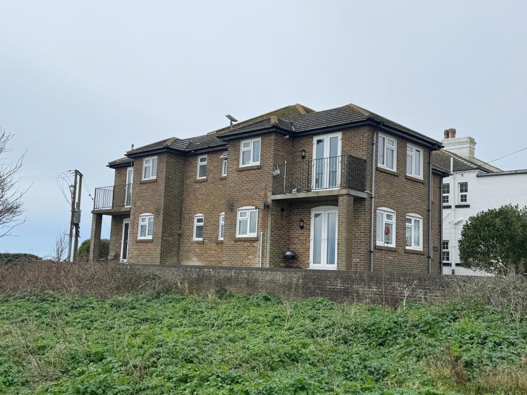 Lot: 103 - TWO-BEDROOM FLAT WITH SEA VIEWS AND SHARE OF FREEHOLD - Outside - elevation one
